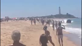 Migrants land on packed beach in southern Spain