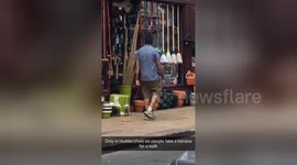 Man walks a banana down the street