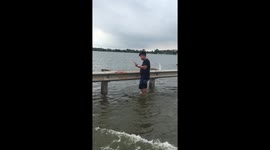 Children play on flooded road in Vietnam