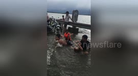 Children play on flooded highway in Vietnam