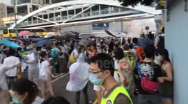 Protesters flee teargas fired by police in Hong Kong protests