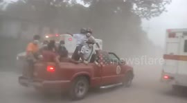 Rescuing survivors of Volcan de Fuego's eruption in San Miguel Los Lotes