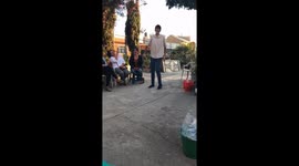 Teenage humpback poor local neighborhood  boy in México dancing weird and funny for family and money