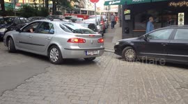 Cars ignoring no-entry sign have to reverse back down the street