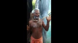 A fearless man with snake.