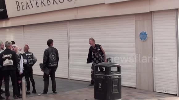Punk  skate boarder bangs his head