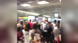 Passengers look uncertain as Frankfurt Airport terminal evacuated