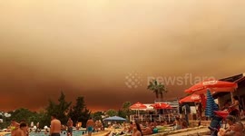 Looks like a holiday of horror! Tourists shocked by huge cloud of smoke filling the sky