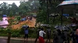 Horror moment villagers watch landslide burying their homes