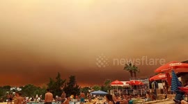 Looks like a holiday of horror! Tourists shocked by huge cloud of smoke filling the sky