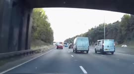 Van drivers pass drink from one van to another at 60mph on M5 Motorway