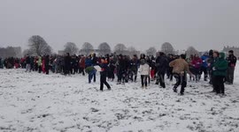 A mass of people turn up for a snowball fight