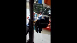 Children use boat to get around after their homes flooded