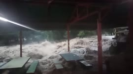 Dramatic moment flash flood engulfs cafe in Thailand