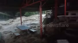 Dramatic moment flash flood engulfs cafe in Thailand