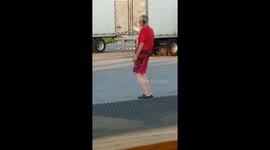 Man in Red dancing at truckstop