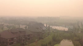 Thick haze and smoky skies in British Columbia as wildfires spread through Canadian province