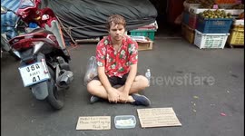 A traveler Begging at the Street of Hatyai Thailand