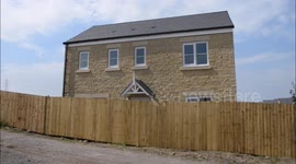 A newly-wed couple's newly-bought dream home view has been wrecked by a SIX FOOT fence outside their front window