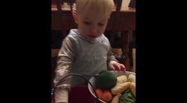 Two year old schooling his mama in all things vegtables