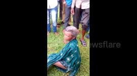 Three men jump into flooded river to save elderly woman