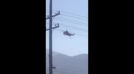 Helicopters continue to load up with water from Corona Lake to put out flare ups from the Holy Fire in the Cleveland National Forest started on August 6 2018 by a human. More than 22,000 acres burned.