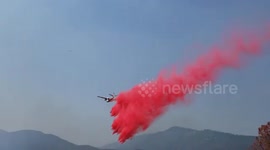 Plane drops retardant on Gorge Fire in Shasta County