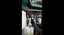 Gatwick staff use whiteboard to update airport passengers on flight times and gates after IT meltdown