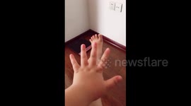 Woman moves hand and foot synchronously with music