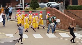 Clowns dance outside McDonald's UK headquarters in animal rights protest