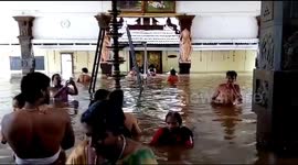 Devotees pray at submerged temple during Kerala floods