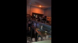 Man falling at bar