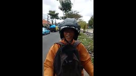 Pavement vigilante confronts people riding on the walkway in Bali