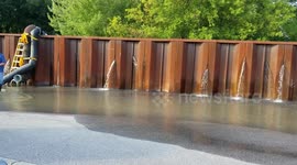 Makeshift dam in Wisconsin barely able to hold back floodwater