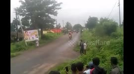 Man fighting for his life after he toppled from a cart during a dangerous horse race - and was run over by the rest of the competitors