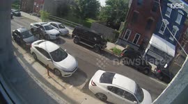 Women opens car door into traffic and it's nearly ripped off