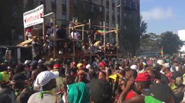 NYC: J’Ouvert Revelers Fill the Street alongside Parade Float