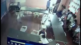 Schoolboy wakes up and puts plastic chair on his back like a rucksack