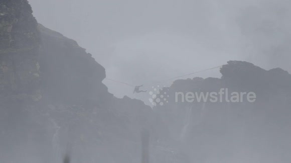 Daredevil slacklines over monster waves in Nazare, Portugal