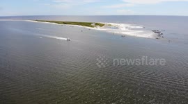 boats anchored on beach shoreline