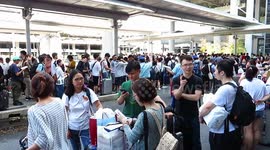 Thousands of stranded passengers and airport employees queue for shuttle services out of Kansai Airport island