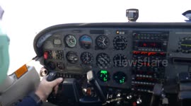 Cockpit and pilot on a flying small airplane