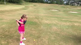 5 year old girl golfing ripping it down the fairway