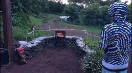 man lights up bbq with a drone