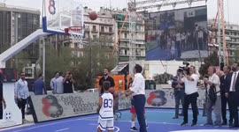 Greece's Prime Minister plays basketball during Thessaloniki International Fair