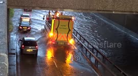 cars broken down during rain floods on Highway