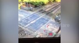 Lorry driver hunted by police for smashing through barriers of level crossing