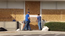 N. Carolina Coast: Work crew boards up building as Florence nears