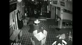 Thief caught on CCTV crawling Mission Impossible-style during burglary