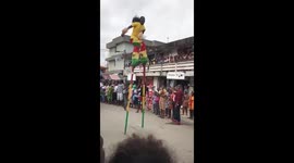 MAN SHOWING SOME ACOBATICS MOVES AT FESTIVAL FALLS.